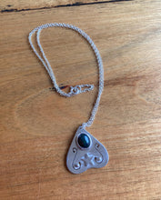 Load image into Gallery viewer, This is a one off hand made piece featuring a black, ethically sourced Ethiopian opal as the Planchette 'eye'. Photos do not do this opal justice, it has beautiful flashes of green, blue, red, yellow, and it has a honeycomb like pattern.